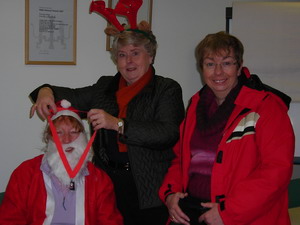 president maggie with medal at hospice santa dash