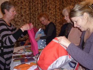 soroptimists packing backpacks for marys meals
