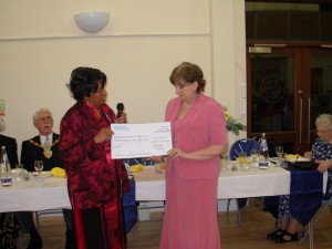 President Lynette (left) presents a cheque for £2000 to the Chair of Croydon Women's Aid