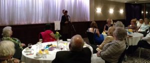 Amal Azzudin speaking to Soroptimists and guests
