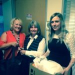 Cynthia receiving items for our New Start and Christmas bags from the staff of New Futures.