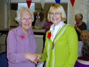 President Lesley presents Irene Brierley with her long service award at the Afternoon tea