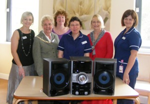 President Glennys & IPP Lesley presnet the Hi-Fi to rossendale Hospice in memory of Maureen Kelly-Hewitt who died in 2009.