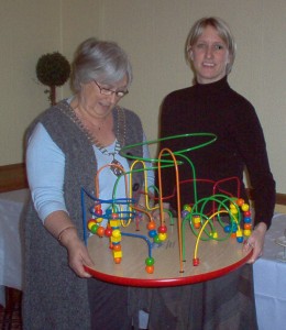President Jenny (2008) presenting a play station to Sam Price of Women's Aid
