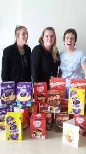 Jackie and Paula with the manager of the Women's Centre and the Soroptimists donation of Easter eggs