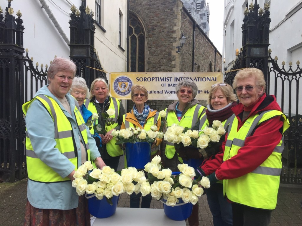 Giving out cream roses on International Womens Day