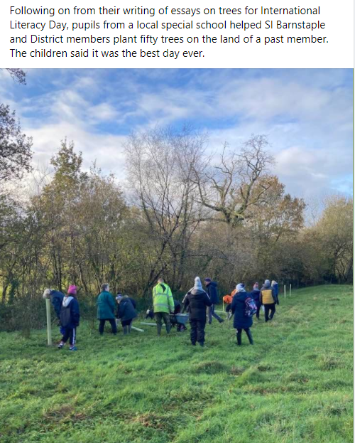 Working with children from a local Special school to plant trees on a former member`s land.