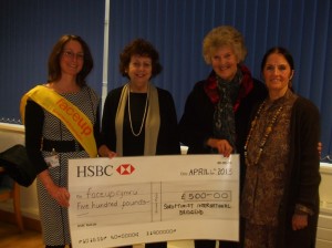 Past President Kathryn presenting cheque to Face Up Cymru