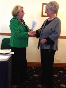 Outgoing President Barbara welsomes new member Gill into the Club