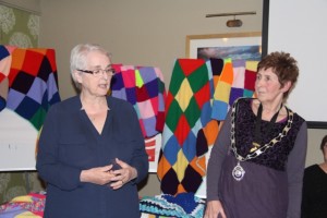 Angela Gorman accepting the blankets from President Bethan