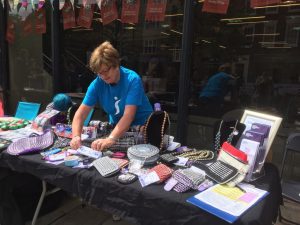 Mavis selling jewellery for the Purple Community Fund