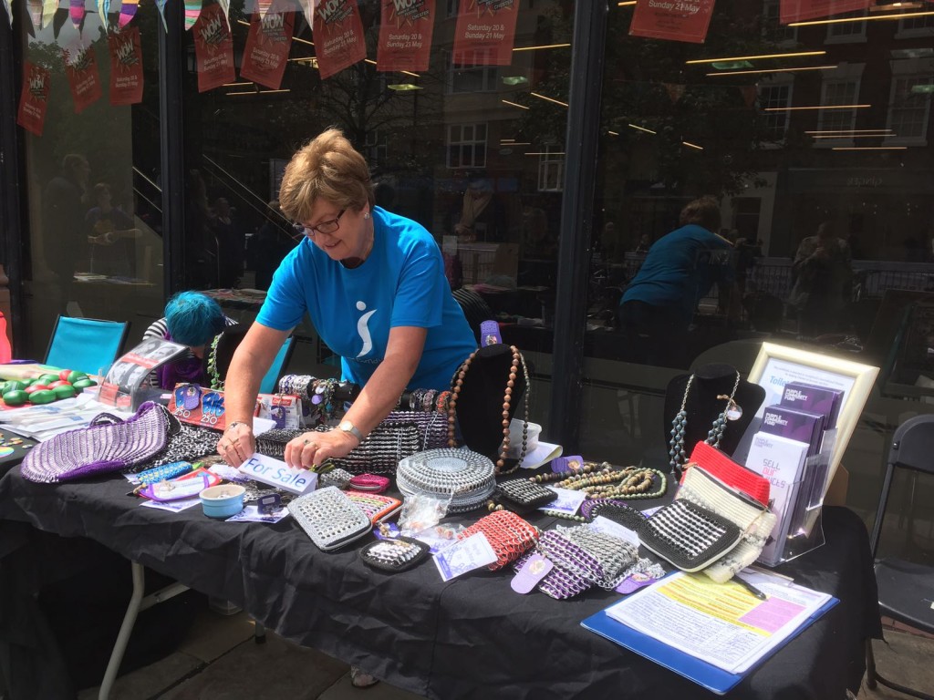 Mavis selling Jewellery for the Purple Community Fund