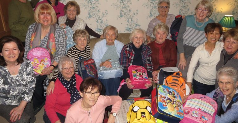 Soroptimists with backpacks for Mary's Meals