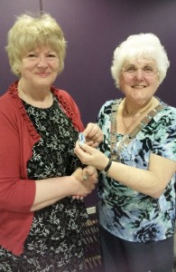 Alma presents Linda with her Past President's badge