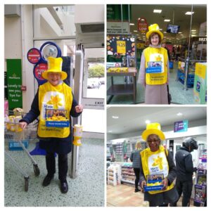 Soroptimist members in Marie Curie tabards and hats collecting donations.
