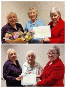 women holding certificates. 