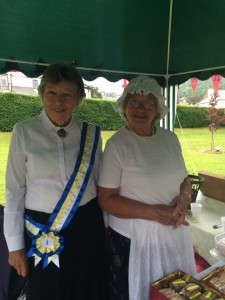 Norma and Sue selling cakes