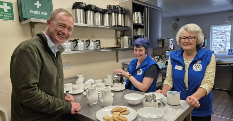 Local MP Tim Farron joins the Soroptimist team in the kitchen.