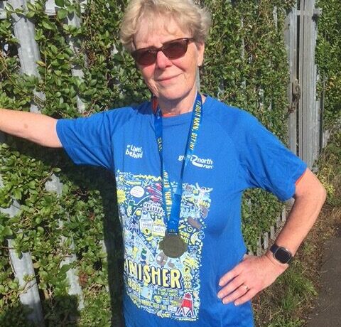 Maureen wearing her finisher t-shirt after competing the great north run