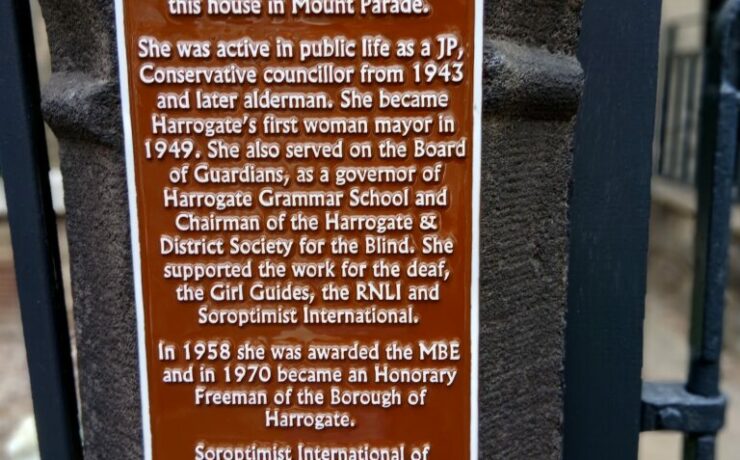 Brown Civic plaque on a gate post