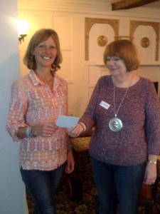 President Sarah hands a cheque for £20 to Vic Hobson Mudlarks