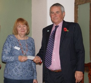 President Sarah presents a cheque to Graham Craker