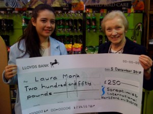 Regional President Pam presenting cheque to Laura