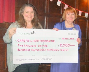 Presiident Sarah presents cheque for £2,000 to Carers in  Hertfordshire