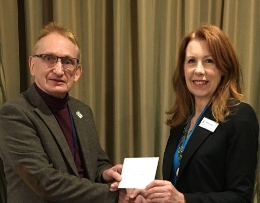 Andy Bower from Trussell Trust receiving cheque from President Sandra