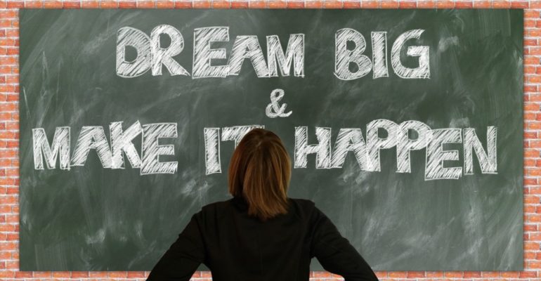 Woman looking at a blackboard