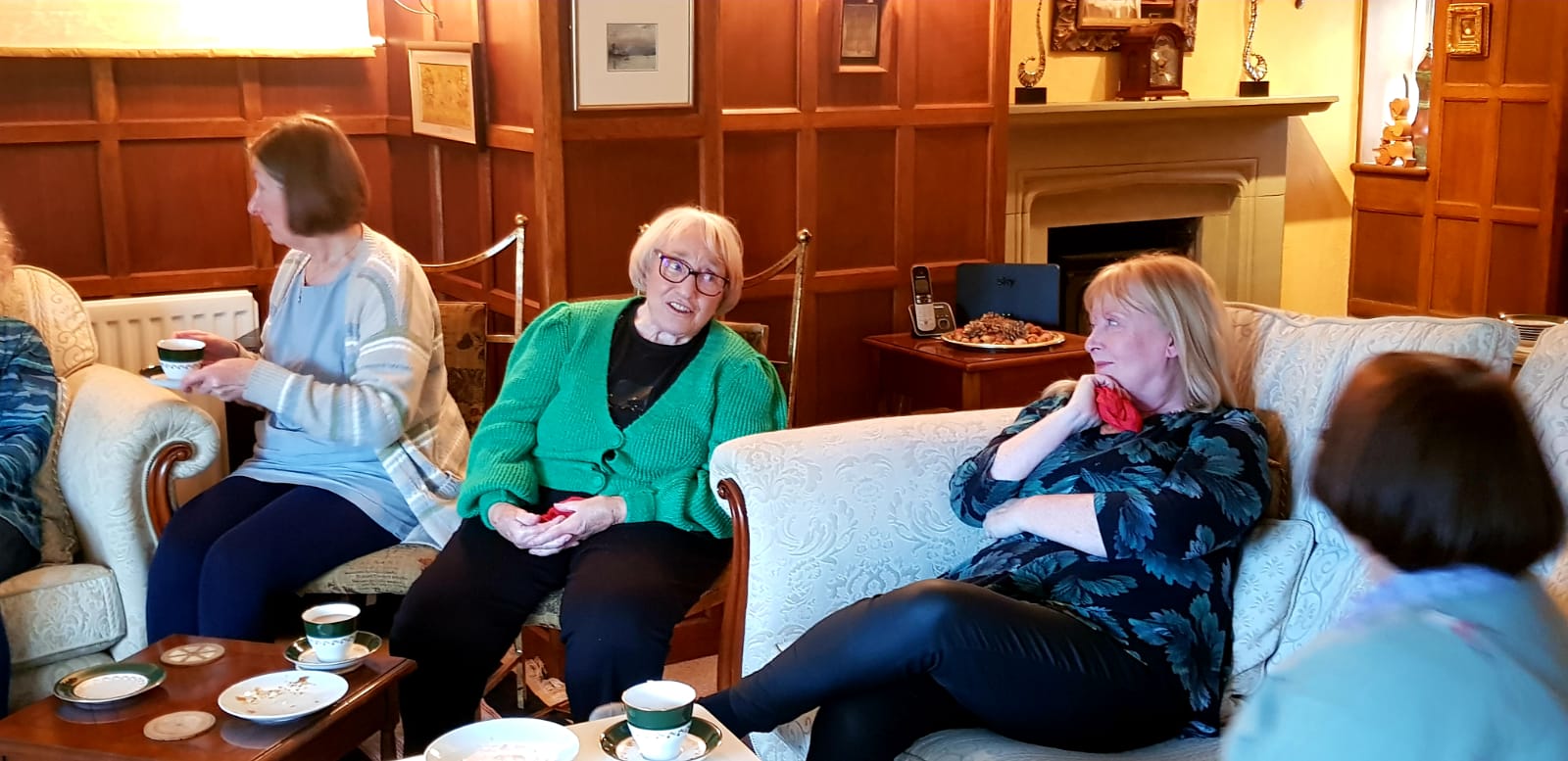 women laighing ina stiiting room