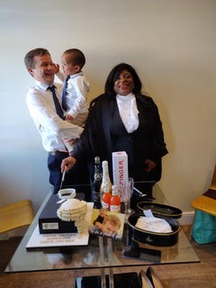 woman of colour with her family celebrating being called to The Bar