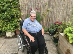lady in a wheelchair in her garden