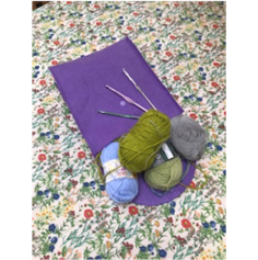 purple bag with crochet items