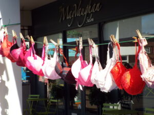 pink bras on a washing line