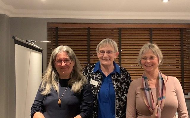 A representative of the growing club with two club members.