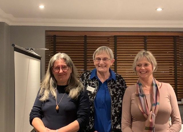 A representative of the growing club with two club members.