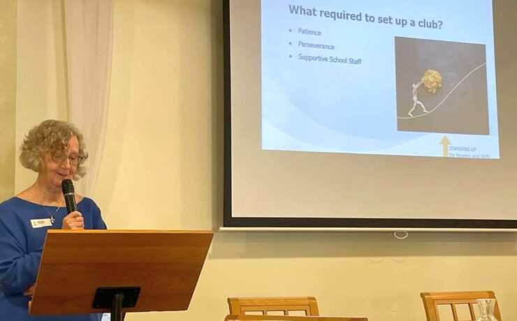 Member giving talk at a meeting