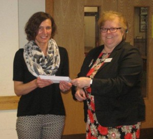 Tracy receives cheque from Lesley