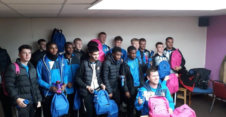 Young men and their trainer at Lichfield FC Academy