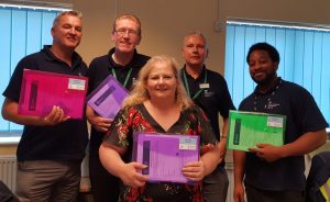 Driving instructors with their domestic abuse safeguarding packs