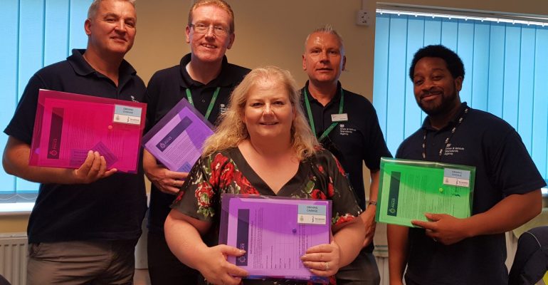 Driving instructors with their domestic abuse safeguarding packs