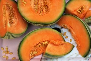 Image of melons cut in half and slices