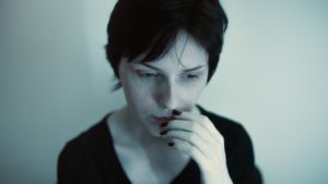 Photo of a woman with an anxious expression
