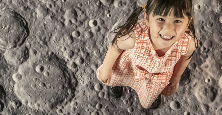 International Day of Human Space Flight -Photo of little girl apparently standing on the surface of the moon