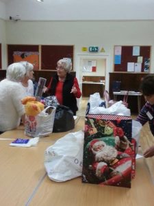 Members busy packing gifts.