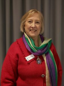SILC IWD Ruth Healey SIGBI Pres-Elect with suffragette scarf