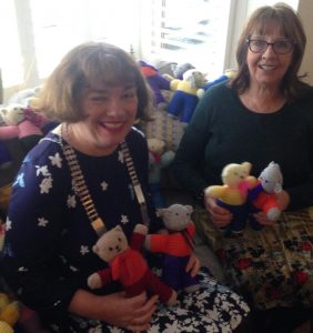 President Kathy Warrick and APD Margaret Clark showing Hand-knitted Trauma Teddies