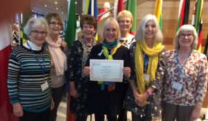 Club member Janice (singing leader) with the Best practice award and Grange Soroptimists at Cardiff Conference