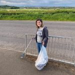 Girl picking up litter